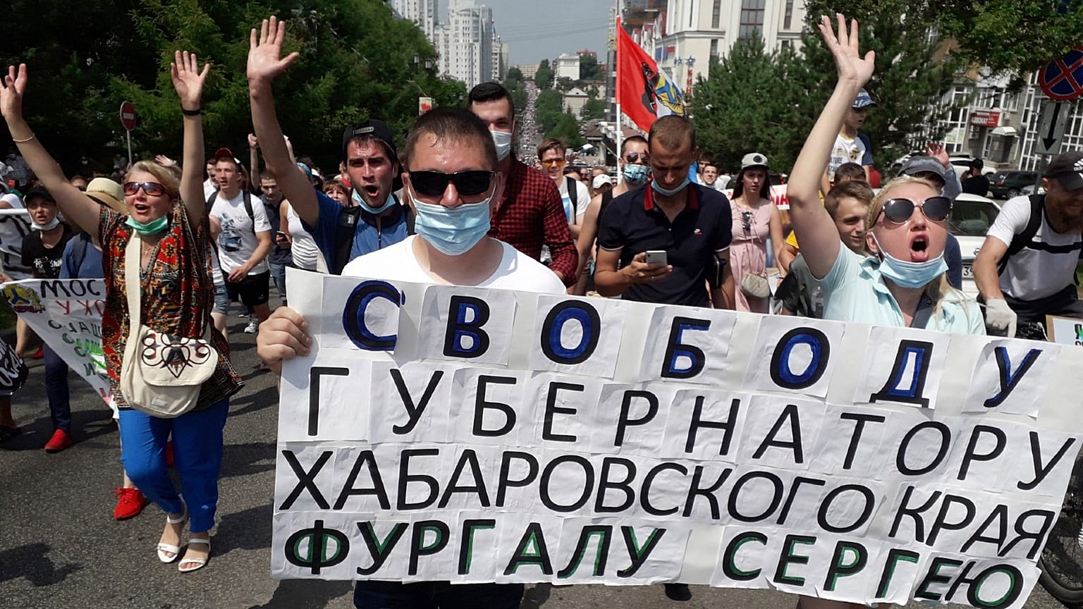 People hold posters reading "Freedom for Khabarovsk region's governor Sergei Furgal" during an unsanctioned protest in Khabarovsk, Russia. July 18, 2020.