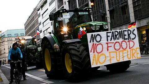 Farmers with tractors arrive for a protest against the German and European agriculture policy in Berlin, Nov. 26, 2019. 