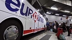Passengers wait to board a Eurolines bus in France. 6 April, 2012.