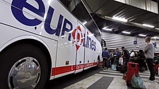 Passengers wait to board a Eurolines bus in France. 6 April, 2012.