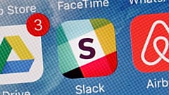 The Slack app is displayed on a mobile phone.
