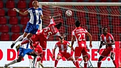 Porto's Pepe, left, jumps for the ball with Aves' Estrela during the Portuguese League soccer match between CD Aves and FC Porto in Vila das Aves.