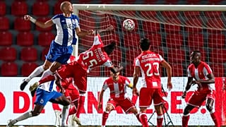 Porto's Pepe, left, jumps for the ball with Aves' Estrela during the Portuguese League soccer match between CD Aves and FC Porto in Vila das Aves.