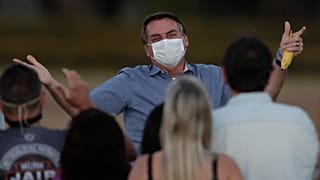 The Brazilian President greeted supporters shortly after announcing he was COVID-19 free.