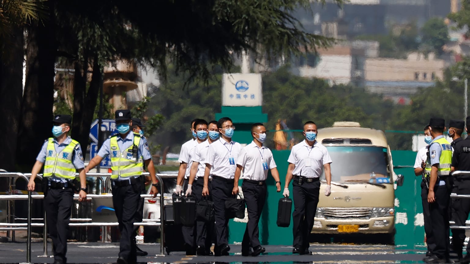 Chinese security personnel walk outside the United States Consulate in Chengdu in southwest China's Sichuan province on Monday, July 27, 2020