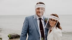 World's first couple get married in plastic-free PPE