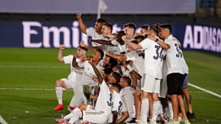 Real Madrid's players pose for the photographers with the trophy as they celebrate winning the Spanish La Liga 2019-2020.