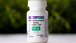 File photo shows a bottle of hydroxychloroquine tablets.