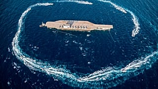 Footage aired on Iran's state television showed the paramilitary Revolutionary Guard firing a missile from a helicopter, which targeted the US mock-up aircraft carrier.