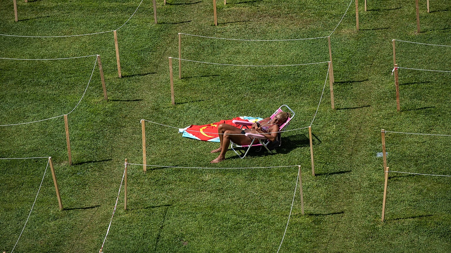 A sunbather relaxes on a hot summer's day in Rivas-Vaciamadrid, Spain. July 29, 2020
