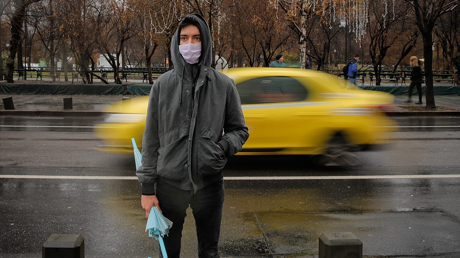 A man wears a mask during an anti-pollution protest outside the city hall in Bucharest, Romania