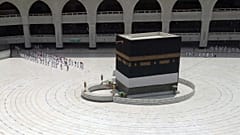 Muslim pilgrims line up to leave after they circled the Kaaba, the cubic building at the Grand Mosque,