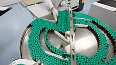 A laboratory technician is seen at a Sanofi-Pasteur production plant manufacturing Panenza, a vaccine for the H1N1 flu virus