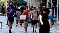 People with masks in downtown Athens