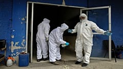 Workers at the crematorium at Xilotepec Cemetery in Xochimilco, Mexico City