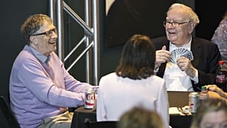 Berkshire Hathaway Chairman and CEO Warren Buffett, right, plays bridge with Microsoft co-founder, Bill Gates