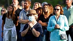 Worshippers attend an outdoor mass at the hippodrome in Cascais, outside Lisbon