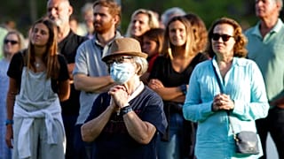 Worshippers attend an outdoor mass at the hippodrome in Cascais, outside Lisbon