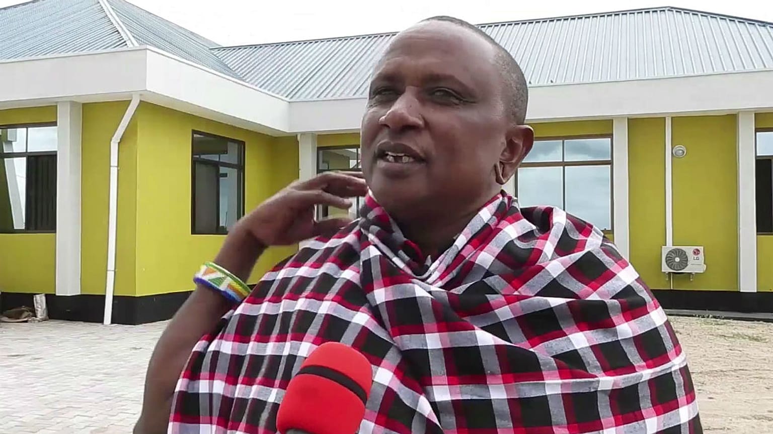Saniniu Laizer speaks to the media after handing over two of the biggest rough tanzanite gemstones ever found to government officials, at a ceremony in Mererani, Tanzania 
