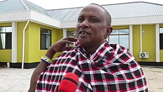 Saniniu Laizer speaks to the media after handing over two of the biggest rough tanzanite gemstones ever found to government officials, at a ceremony in Mererani, Tanzania 
