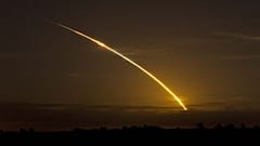 The Space shuttle Discovery streaks across the sky as it clears a cloud bank as seen from Archer, Fla. Saturday, Aug., 29, 2009. Discovery's seven member crew are on a mission