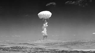 In this April 22, 1952 file photo a gigantic pillar of smoke with the familiar mushroom top climbs above Yucca Flat, Nev. during nuclear test detonation.