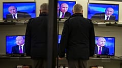 Владимир Путин на экранах телевизоров 18 декабря 2014.