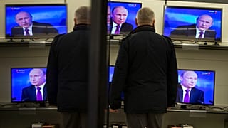Владимир Путин на экранах телевизоров 18 декабря 2014.
