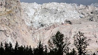 The Planpincieux glacier located in the Alps on the Grande Jorasses peak of the Mont Blanc massif, is seen from Val Ferret, near Courmayeur, northern Italy, Aug. 5, 2020.