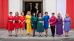 Left wing parliamentarians dressed in the colours of the rainbow pose in front of the Polish Parliament (Sejm)