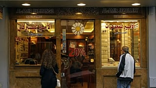People stand outside a money exchange company, in Beirut, Lebanon