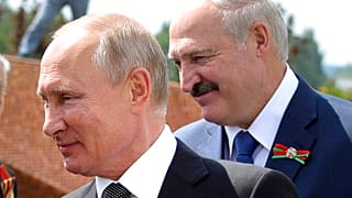 In this June 30, 2020 file photo, Russian President Vladimir Putin, left, and Belarusian President Alexander Lukashenko greet WWII veterans, in Khoroshevo,Russia