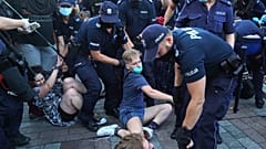 Dozens were arrested as they tried to stop the detention of an LGBT activist. 