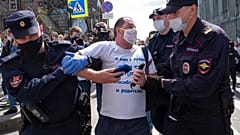 Police detain a protester during a rally supporting Khabarovsk region's governor Sergei Furgal in St.Petersburg, Russia, Saturday, Aug. 1, 2020