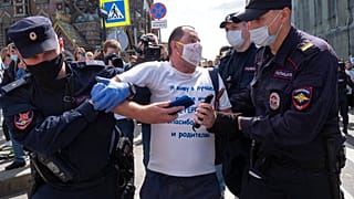 Police detain a protester during a rally supporting Khabarovsk region's governor Sergei Furgal in St.Petersburg, Russia, Saturday, Aug. 1, 2020