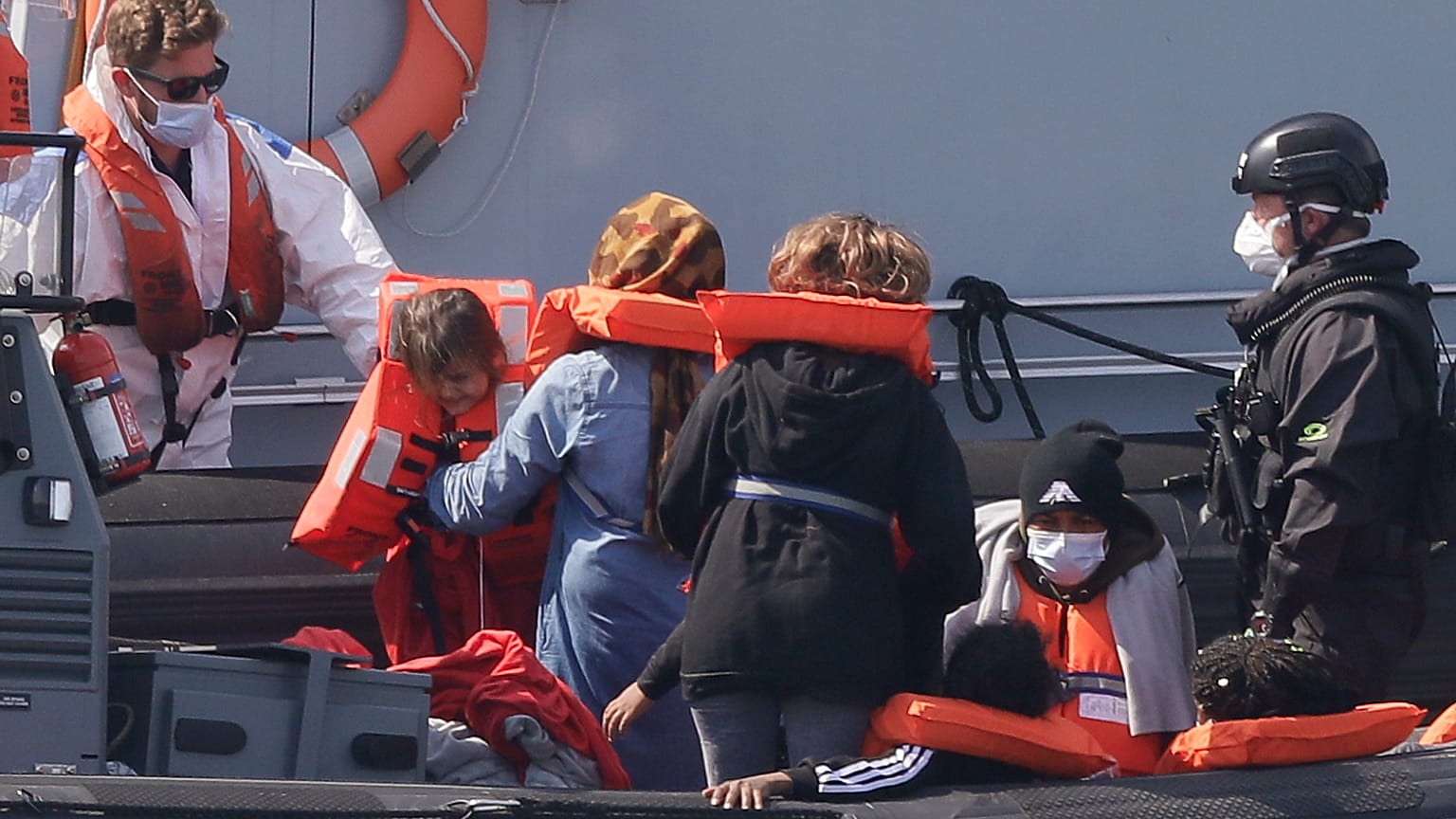 A Border Force vessel brings a group of people thought to be migrants into the port city of Dover.