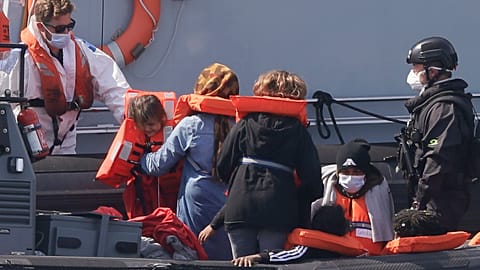 A Border Force vessel brings a group of people thought to be migrants into the port city of Dover.