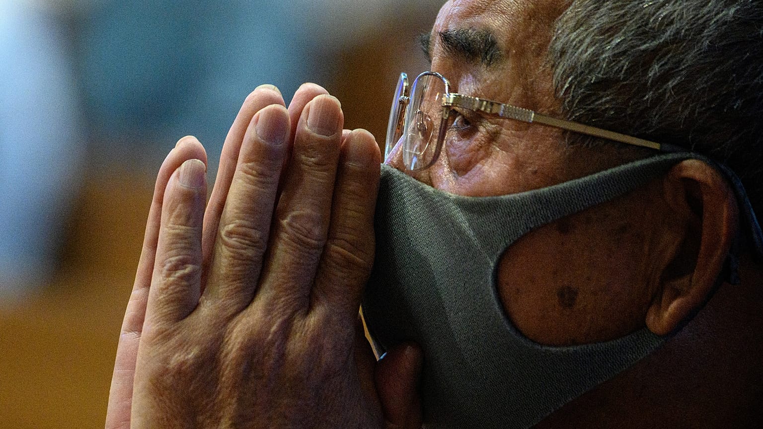 A man attends mass held in memory of bomb victims at Urakami Church to mark the 75th anniversary of the atomic bombing of Nagasaki, in the city on August 9, 2020.