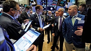 Stock market traders investing your money.
