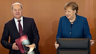German Chancellor Angela Merkel arrives besides Vice Chancellor and Finance Minister Olaf Scholz 