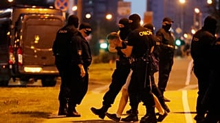 A police officer detain a protester during a rally after the Belarusian presidential election in Minsk, Belarus. Aug. 9, 2020. 