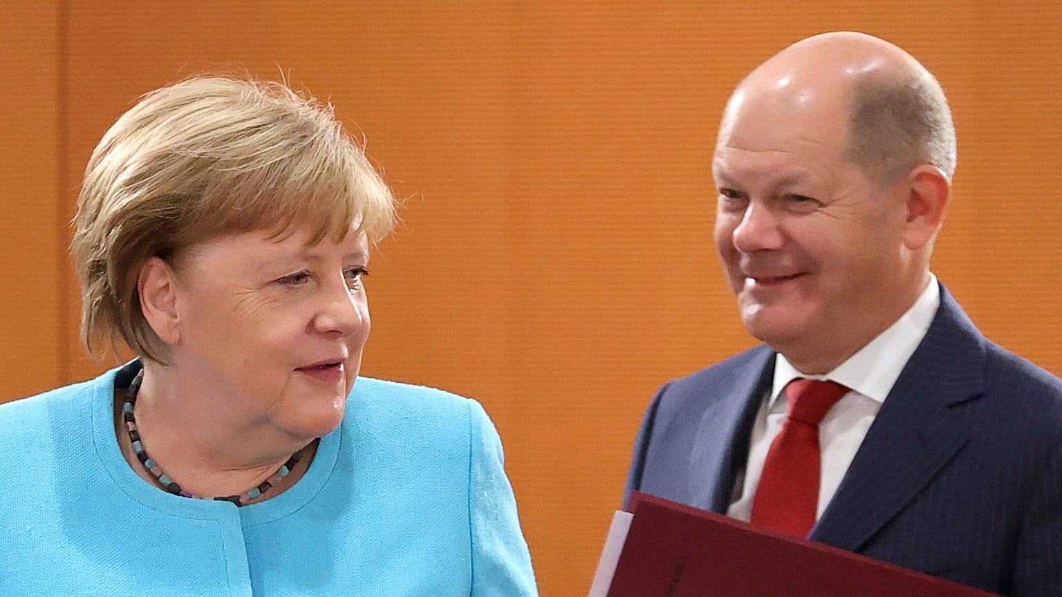 Olaf Scholz (right) has been serving as minister of finance and vice chancellor under Angela Merkel (left) since March 2018