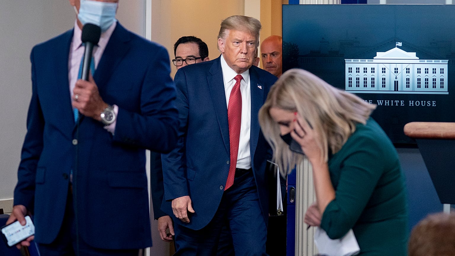 Donald Trump left the briefing for a short while, before returning and asking: "Do I seem rattled?"