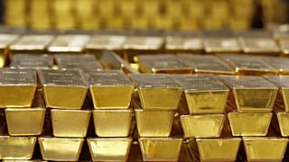 Gold bars are stacked in a vault at the United States Mint, in West Point, N.Y
