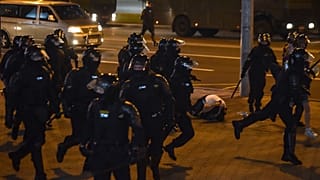 Riot police detain protesters during a rally of opposition supporters