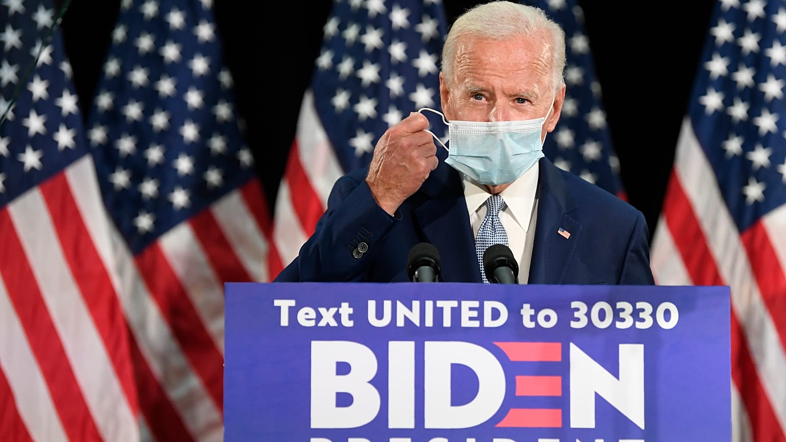 Democratic presidential candidate, former Vice President Joe Biden takes off his mask