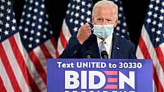 Democratic presidential candidate, former Vice President Joe Biden takes off his mask
