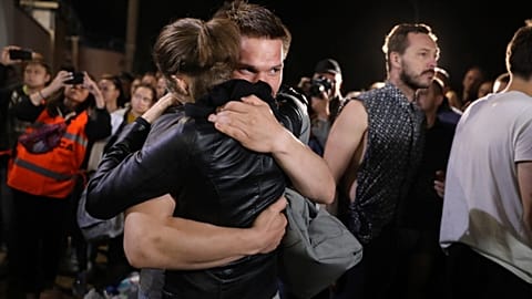 A couple hug after being released from a detention centre where protesters were detained during a mass rally following the presidential election in Minsk, Belarus. August 14