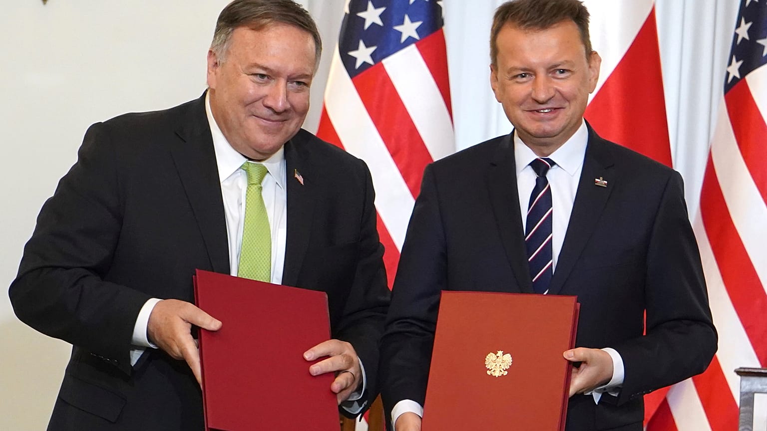 US Secretary of State Mike Pompeo, left, and Poland's Minister of Defence Mariusz Blaszczak after signing a defence cooperation deal.