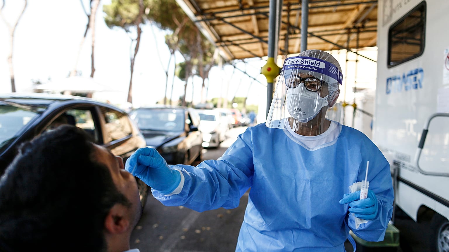 A man undergoes testing for COVID-19 at Rome's San Giovanni Addolorata hospital, Friday, Aug. 14, 2020.